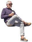 Photoshop people cutout - elderly man sitting in the park, drinking coffee - miniature