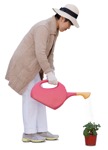 Middle-aged Asian woman watering a plant - People PNG  - miniature