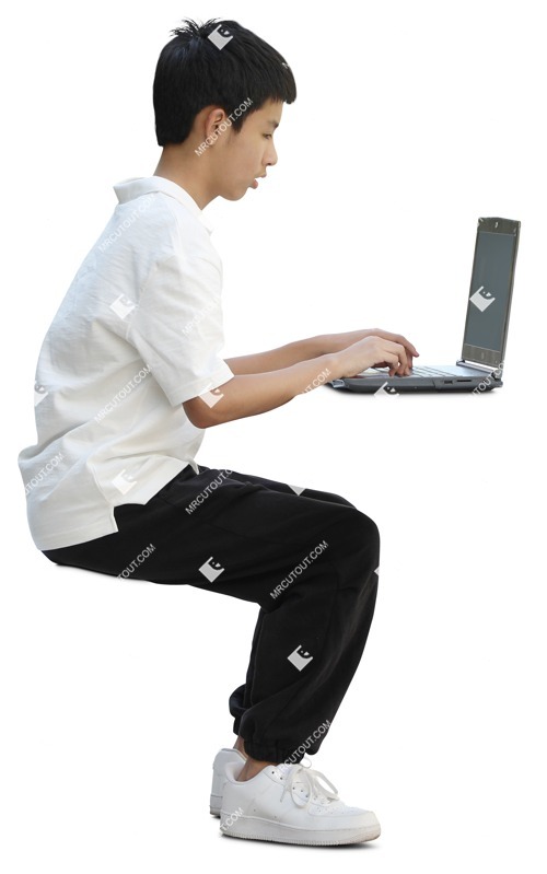 Boy with a computer writing cut out pictures (17880)