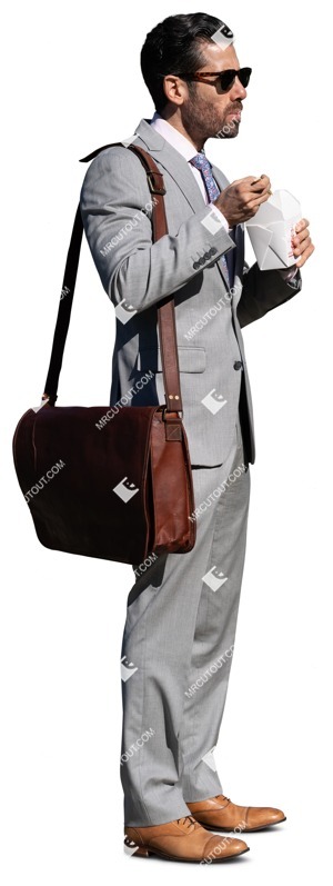 Businessman eating cut out pictures (13543)