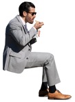 Businessman eating seated cut out pictures (14582) - miniature