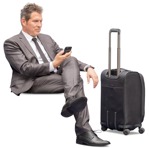 Businessman with a baggage sitting human png (12243) - miniature