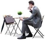 Cut out people - Businessman With A Smartphone Drinking Coffee 0005 | MrCutout.com - miniature