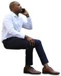 Businessman with a smartphone sitting  (9607) - miniature
