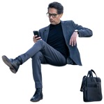 Businessman with a smartphone sitting  (15057) - miniature