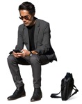 Businessman with a smartphone sitting entourage people (14860) | MrCutout.com - miniature