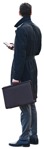 Businessman with a smartphone standing  (8307) - miniature