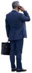 Businessman with a smartphone standing  (14085) - miniature