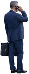 Businessman with a smartphone standing  (12265) - miniature