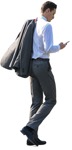 A businessman walking straight checking his cellphone - people png - miniature