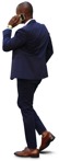 Cut out people - Businessman With A Smartphone Walking 0040 | MrCutout.com - miniature