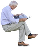 Elderly reading a newspaper sitting  (3537) - miniature