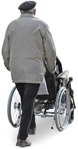 Cut out people elderly man pushing a woman in a wheelchair - miniature