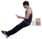 Man with a smartphone eating seated people png (14510) | MrCutout.com - miniature