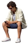 Man with a smartphone sitting people cutouts (13284) | MrCutout.com - miniature