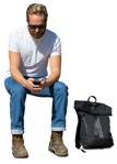 Man with a smartphone sitting entourage people (13860) | MrCutout.com - miniature