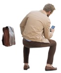 Man with a smartphone sitting cut out people (13878) - miniature