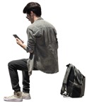 Man with a smartphone sitting person png (14860) - miniature