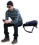 Man with a smartphone sitting human png (14541) - miniature
