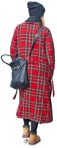 Cut out pictures woman walking in a checked winter coat  | MrCutout.com - miniature