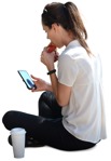 Woman with a smartphone eating seated photoshop people (6498) - miniature