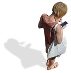 Cut out people - Woman With A Smartphone Standing 0004 | MrCutout.com - miniature